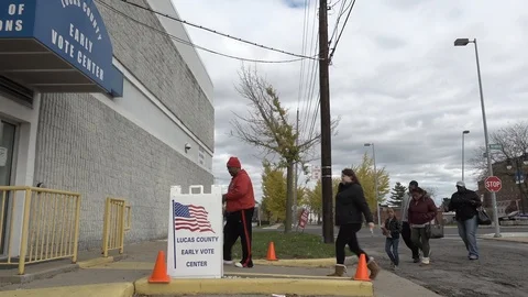 S enter an early polling place for the 2018 election Video stock 97884432