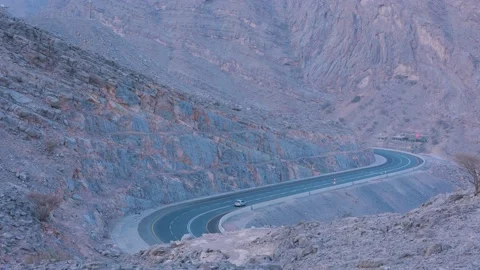 S shape curved mountain road a going back view Stock Footage 159646478
