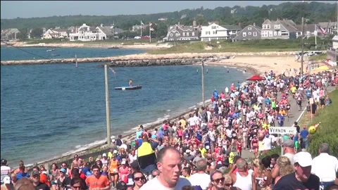 S03152209 Kids on float to runners on final hill Falmouth Road Race Video stock 171888774