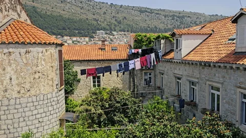 S23-121827-Laundry drying on clothes line in Old Town Dubrovnik, Croatia Video stock 294286710