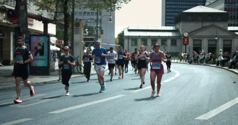 S25 marathon pan drummers to runners Berlin 2023 Stock Footage 332125365
