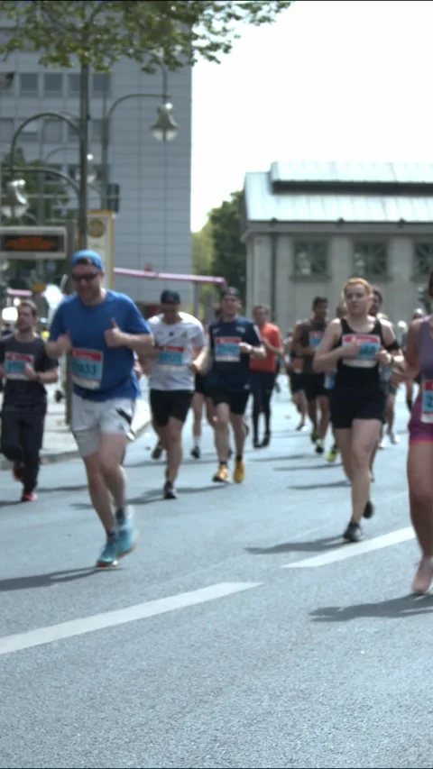 S25 marathon pan drummers to runners Berlin 2023 Stock Footage 332132325