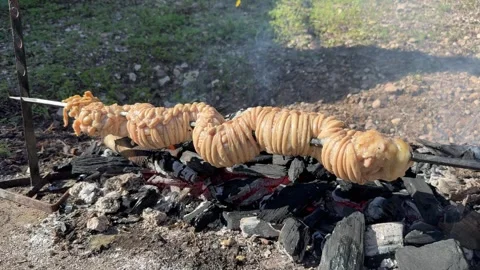 Sa Cordula or sa corda or braided lamb innards cooked on the grill Stock-Footage 292527135