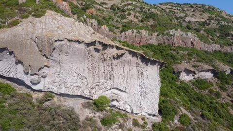 Sa Rocca Pinta, a rock wall with unique shapes due to erosion n Stock Footage 308362389