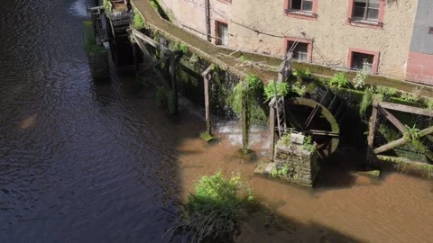 Saar river water grain mill in the town of Saarburg, Germany Old European Stock Footage 332474418