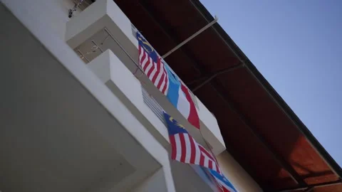 Sabah flag with Malaysia flag view from bottom of the building Stock Footage 136563353