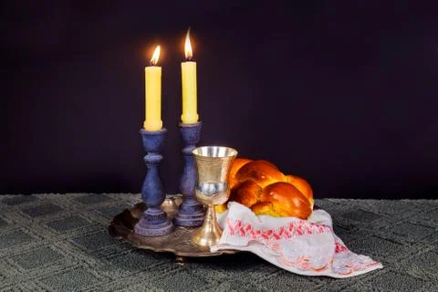 Sabbath image. challah bread and candelas on wooden table Photos