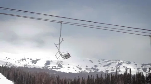 Сableway winter. Snow forest and skiers on a ski lift. 動画素材 63142254