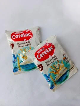 Sachets of Cerelac on white background. Stock Photos