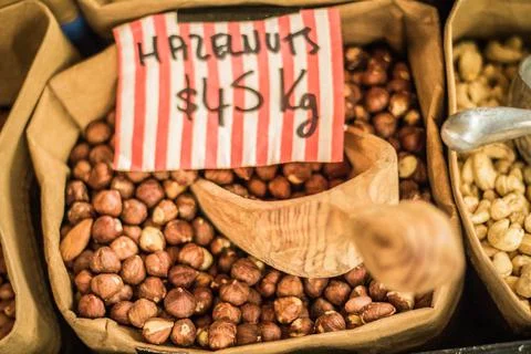 Sack bag full of hazelnut kernels, rustic style photo Stock Photos