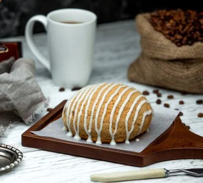Sack with coffee beans and bread topped with cream Stock Photos
