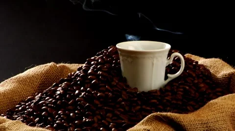 Sack of coffee beans and steaming cup of coffee Stock-Footage 8571446