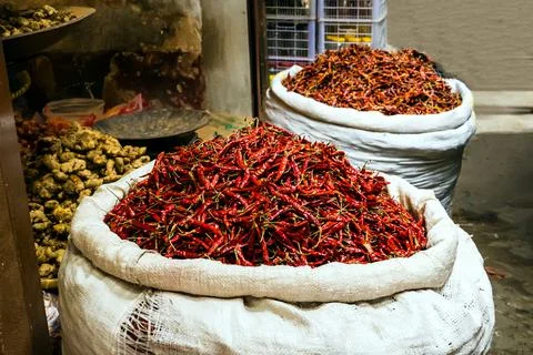 Sack with Dried Red chilli. hot peppers in the market. Stock Photos