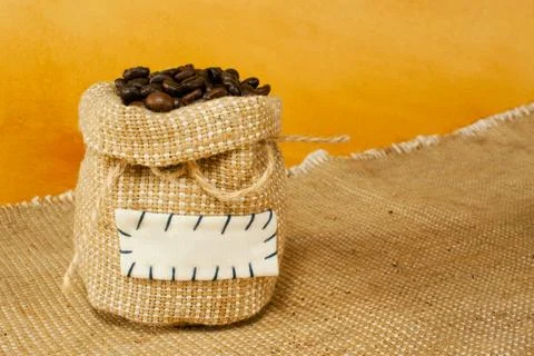 Sack with roasted coffee beans Stock Photos