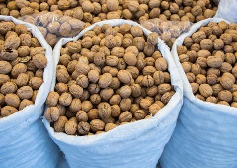 Sack of whole walnuts  with hard nutshells Stock Photos