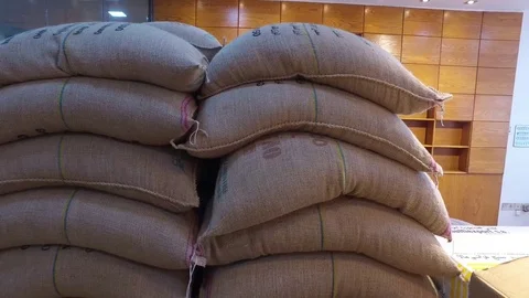 Sacks of coffee. Coffee roasting machine Stock Footage 80580048