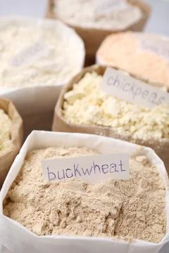 Sacks with different types of flours, closeup Stock Photos