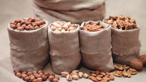 Sacks of different types nuts Stock Footage 72122325