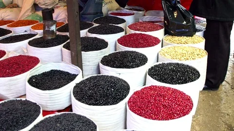 Sacks filled with beans are showed to sell Stock-Footage 94420441