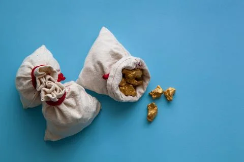 Sacks of gold nuggets Stock Photos