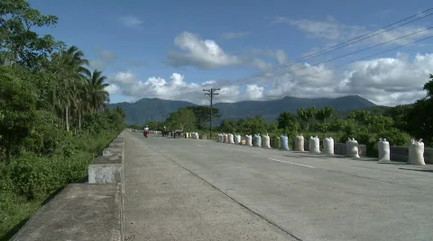 Sacks of Rice on road for drying Stock Footage 474611
