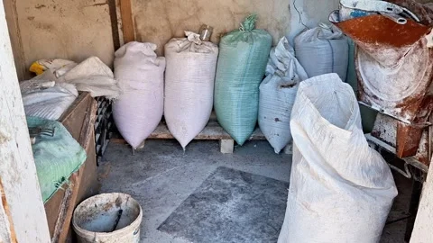 Sacks of Stored Materials in Rustic Shed with Concrete Floor Video stock 330846687