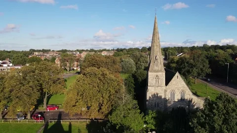 Sacral building among trees in park in town Video stock 164793148
