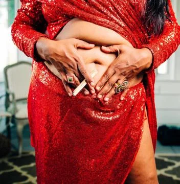 Sacral chakra red sequin holy wood vulnerable sacred sexuality erotic divine Stock-Fotos