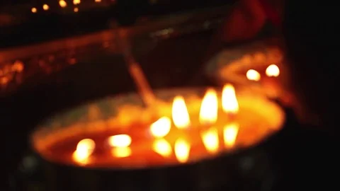 Sacred candles in buddhist monastery, close-up Stock Footage 77212827