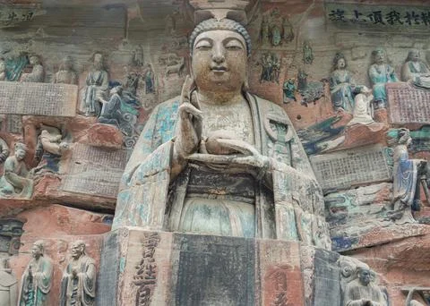 Sacred Compassion and Timeless Devotion  Dazu Rock Carvings. 库存照片
