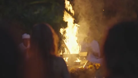 Sacred Fire Ritual with Silhouettes and Bonfire at Night Stock Footage 308998639
