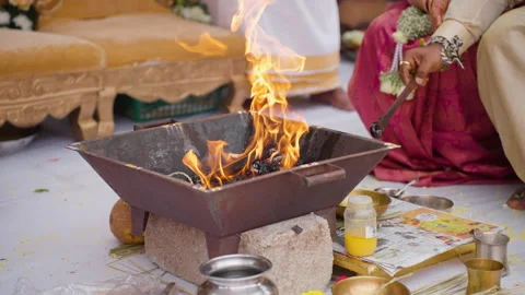 Sacred Havan Fire Melted Ghee Ritual at South Indian Karnataka Wedding Ceremony Stock Footage 345941899