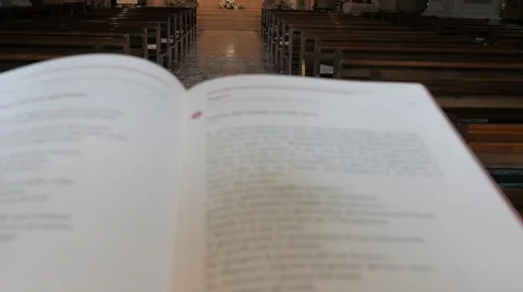 Sacred text on the lectern in the central nave of the church Stock Footage 60029636