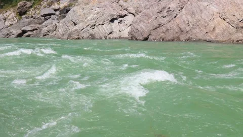 Sacred Waters of Devprayag: Ghat and Aquatic Life Stock Footage 302181801