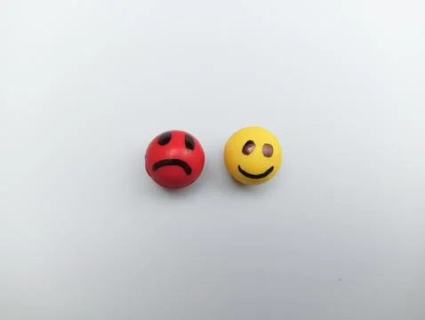 Sad and happy smiley face on white background  Foto stock