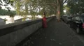 sad and pensive girl with red dress at sunset - steadycam HD Footage