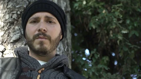Sad and stressed man under a tree Stock Footage 71890643