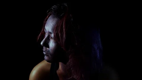 Sad and thinking with weird make up on Stock Footage 123270672