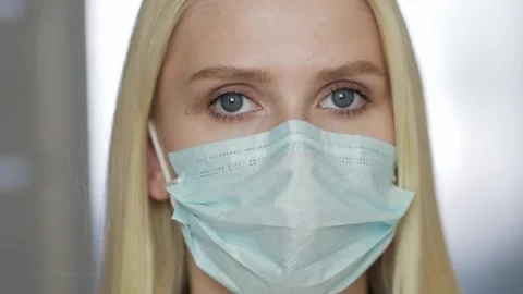 Sad and tired medic opens eyes and looking atraight at camera. medical stuff Video stock 146584567