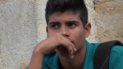 Sad And Unhappy Male Hispanic Teen Stock Photos