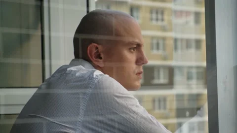Sad bald man standing on the balcony thinking about something, close-up Stock Footage 201212939