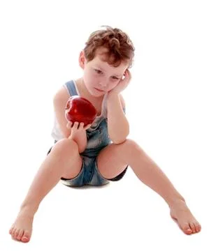 Sad boy with Apple in hand Stock Photos