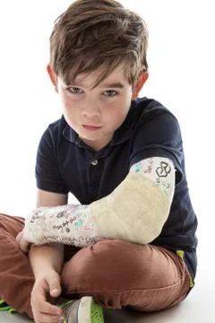 Sad boy with broken arm Stock Photos