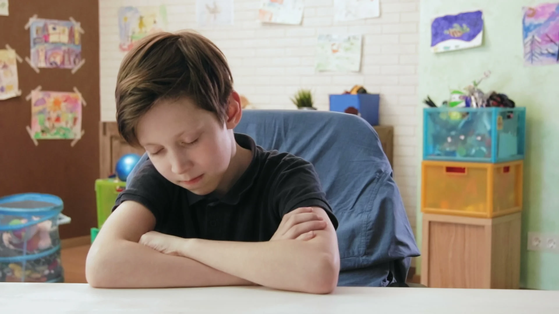 Sad Boy Feeling Sleepy Sitting At The Desk In His Room Footage