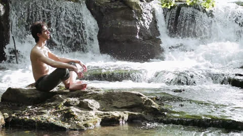 Sad boy looking for himself relaxing in a wonderful place 库存影片 24770269