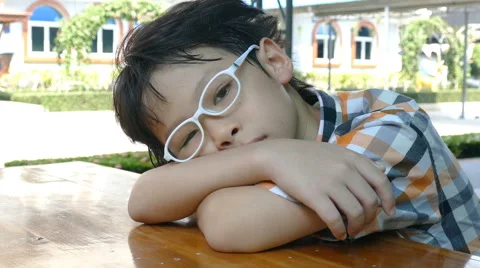 Sad boy sitting alone Stock Footage 64412230