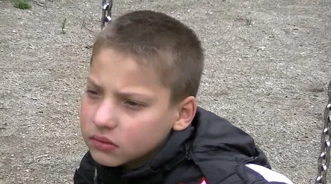 Sad boy on a swing Stock Footage 67858226