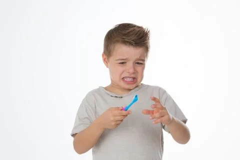 Sad boy with toothbrush Foto stock