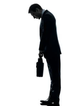 Sad business man  looking down silhouette Stock Photos