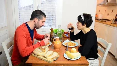 Sad caucasian couple discuss while eat a lunch together in the kitchen 스톡 동영상 122295914